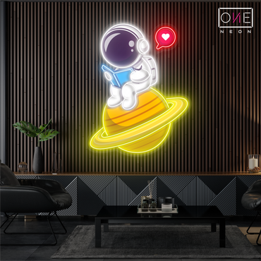 Enseigne néon LED artistique astronaute mignon en train de lire