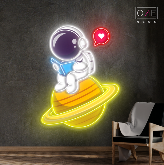 Enseigne néon LED artistique astronaute mignon en train de lire